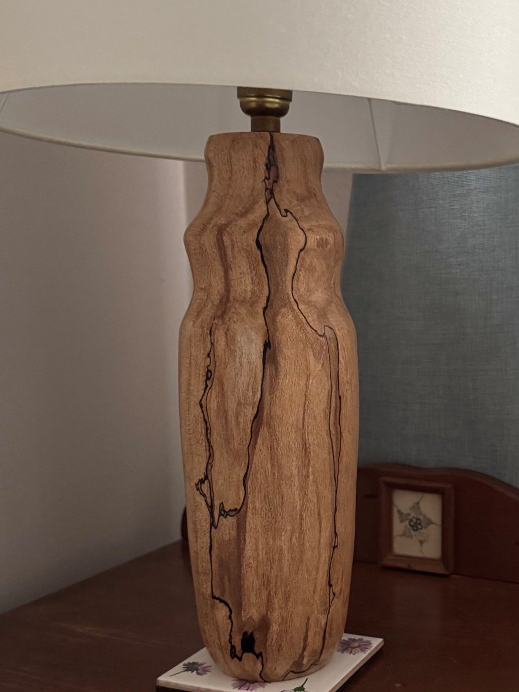 Spalted Beech Lamp Wooden lamp base with a natural, textured finish and a white lampshade.